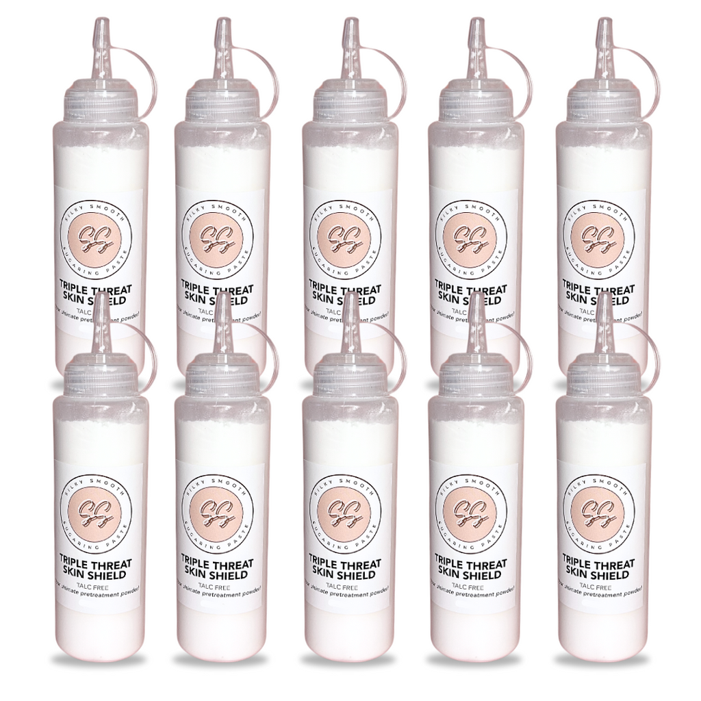 Set of eight clear bottles with labels on a white background