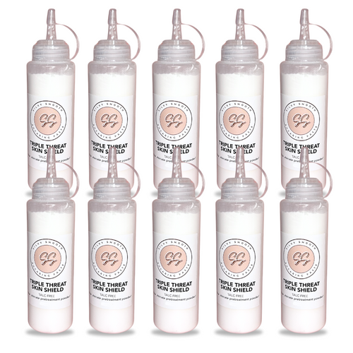 Set of eight clear bottles with labels on a white background